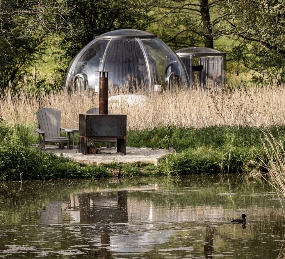 Excelite glamping dome attached with 2.1m glamping bathroom besides a river